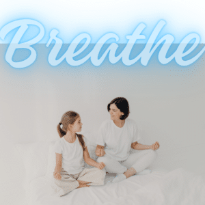 mom daughter in meditation pose with breathe written at the top